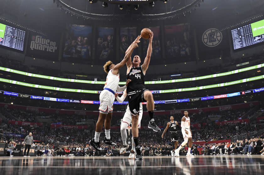 LOS ANGELES, CA - MARCH 11: Mason Plumlee #44 of the Los Angeles Clippers goes up for a layup against Miles McBride #2 of the New York Knicks during the first half at Crypto.com Arena on March 11, 2023 in Los Angeles, California. NOTE TO USER: User expressly acknowledges and agrees that, by downloading and or using this photograph, User is consenting to the terms and conditions of the Getty Images License Agreement. (Photo by Kevork Djansezian/Getty Images)