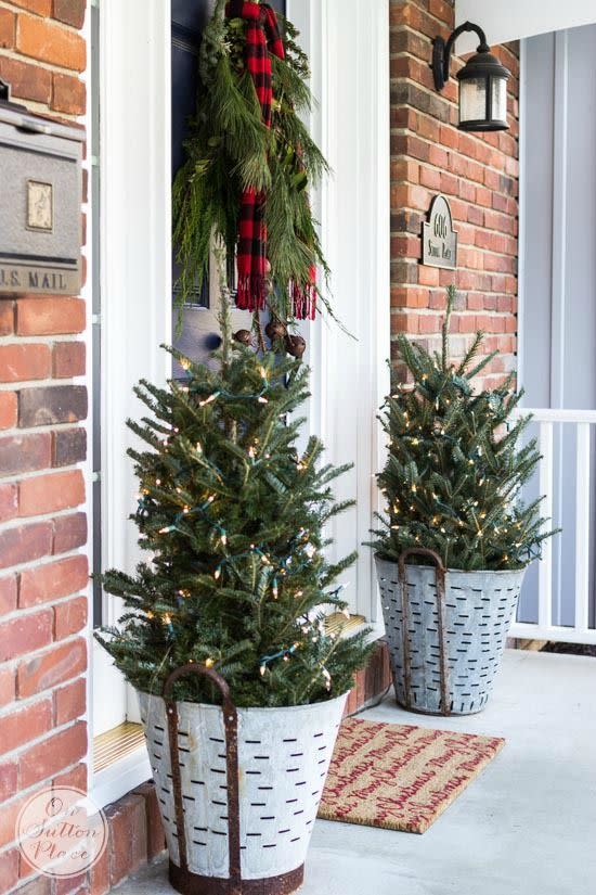 <p>Galvanized planters are durable enough to last through even the harshest winters (ice storms and blizzards, included), while still being chic enough to display mini Christmas trees on your front porch. </p><p><a class="link " href="https://www.amazon.com/Gallon-Bucket-Silver-handle-Basket/dp/B07RJZ13B?tag=syn-yahoo-20&ascsubtag=%5Bartid%7C10055.g.29124481%5Bsrc%7Cyahoo-us" rel="nofollow noopener" target="_blank" data-ylk="slk:Shop Now">Shop Now</a></p><p><em><a href="https://www.onsuttonplace.com/festive-frugal-christmas-porch-decor/" rel="nofollow noopener" target="_blank" data-ylk="slk:See more at On Sutton Place »" class="link ">See more at On Sutton Place »</a></em></p>
