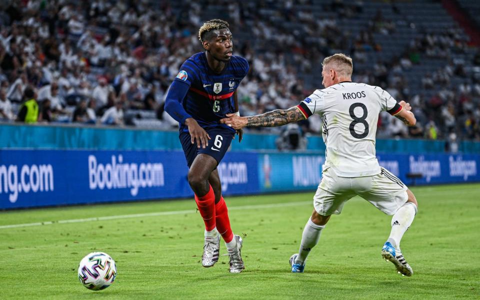 Paul Pogba (L) of France challenges for the ball with Toni Kroos (R) of Germany during the UEFA Euro 2020 Championship Group F match between France and Germany at Allianz Arena on June 15, 2021 in Munich - France vs Germany player ratings: Paul Pogba the standout as world champions begin with a win - GETTY IMAGES