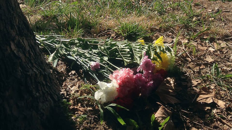 Flowers lay at the scene where authorities say a shooting occurred and the man died at the scene. Photo: AP/Randall Chase