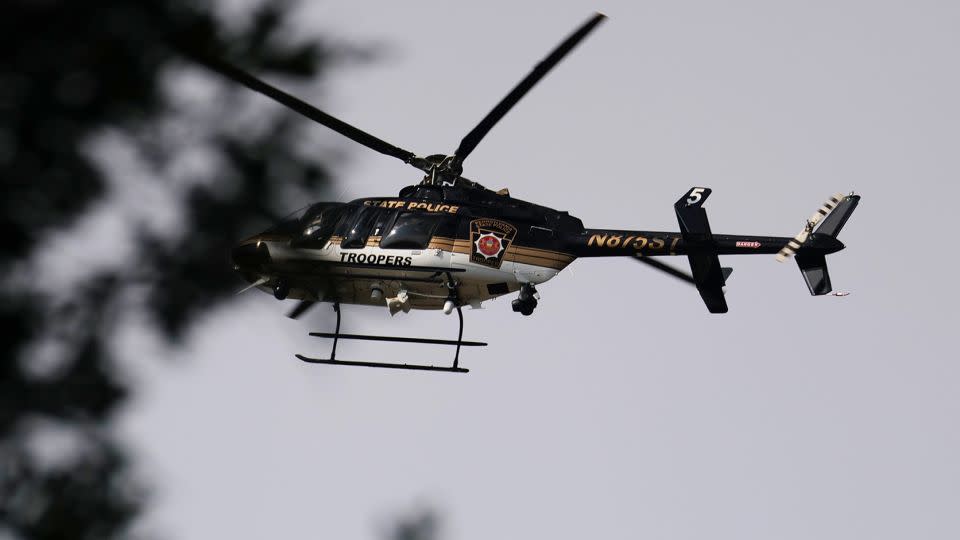 A Pennsylvania State Police helicopter hovers over the perimeter of a search zone for Cavalcante on September 8, 2023. - Spencer Platt/Getty Images