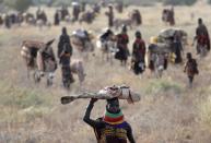 The Wider Image: When raiders menace in northern Kenya, grab your guns