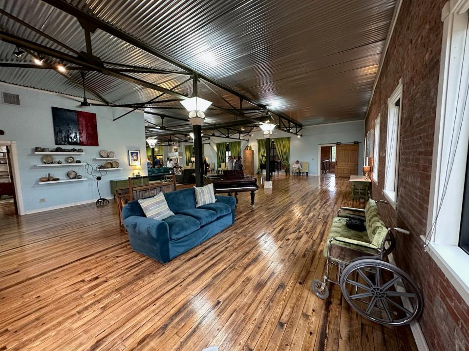 The Hurst Loft has over 6,000 square feet of living space with three bedrooms and two full baths on the second floor. It features an open floor plan, high ceilings along with large windows.