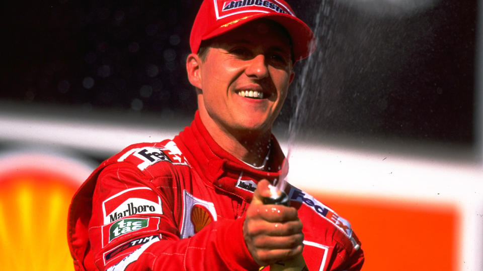 Michael Schumacher of the Ferrari team celebrates coming in second place during the 1999 Brazilian Grand Prix held at the Interlagos Circuit in Sao Paulo, Brazil. Credit: Mark Thompson /Allsport