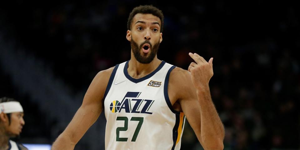 Rudy Gobert waves his hand while yelling.
