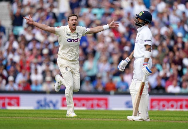 Ollie Robinson celebrates the dismissal of Virat Kohli