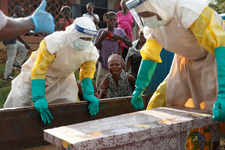 FILE PHOTO: A mother of a child, suspected of dying from Ebola, cries near her child's coffin in Beni, North Kivu Province of Democratic Republic of Congo, December 17, 2018. REUTERS/Goran Tomasevic/File Photo