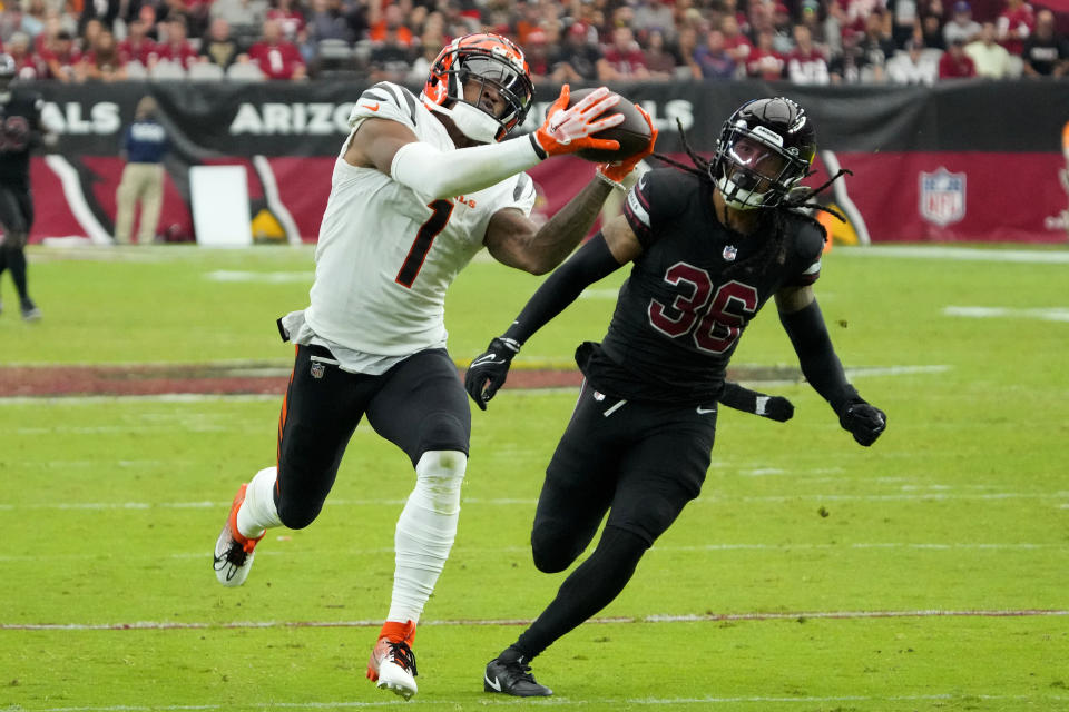 Cincinnati Bengals wide receiver Ja'Marr Chase (1) pulls in a touchdown pass during the second half of an NFL football game against the Arizona Cardinals, Sunday, Oct. 8, 2023, in Glendale, Ariz. (AP Photo/Rick Scuteri)