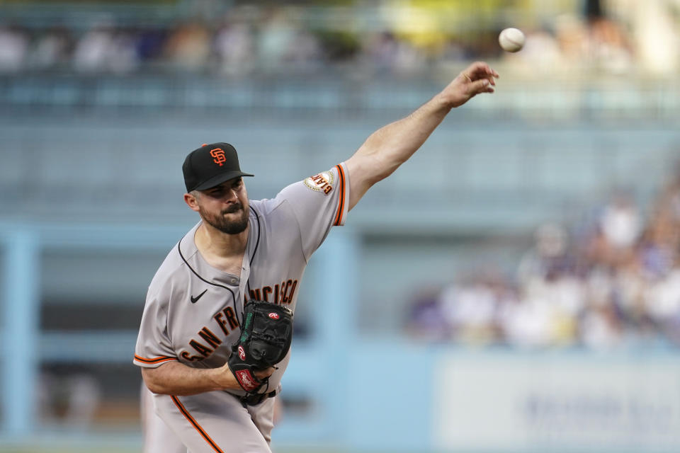 San Francisco Giants starting pitcher Carlos Rodon throws to a Los Angeles Dodgers batter during the first inning of a baseball game Thursday, July 21, 2022, in Los Angeles. (AP Photo/Marcio Jose Sanchez)