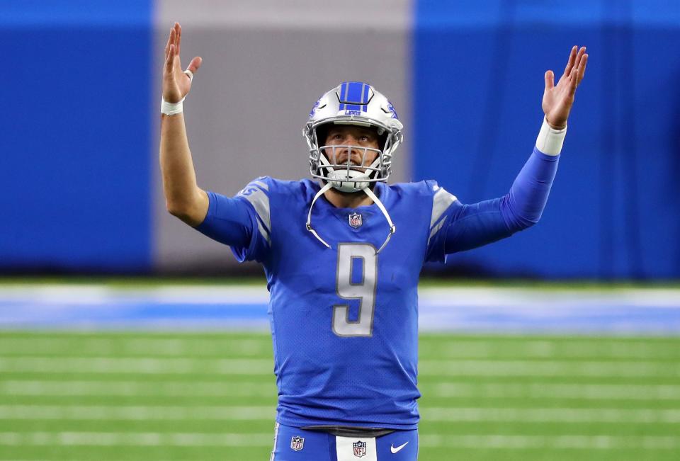 Matthew Stafford of the Detroit Lions signals for a touchdown during the second half against the Green Bay Packers at Ford Field on Dec. 13, 2020.