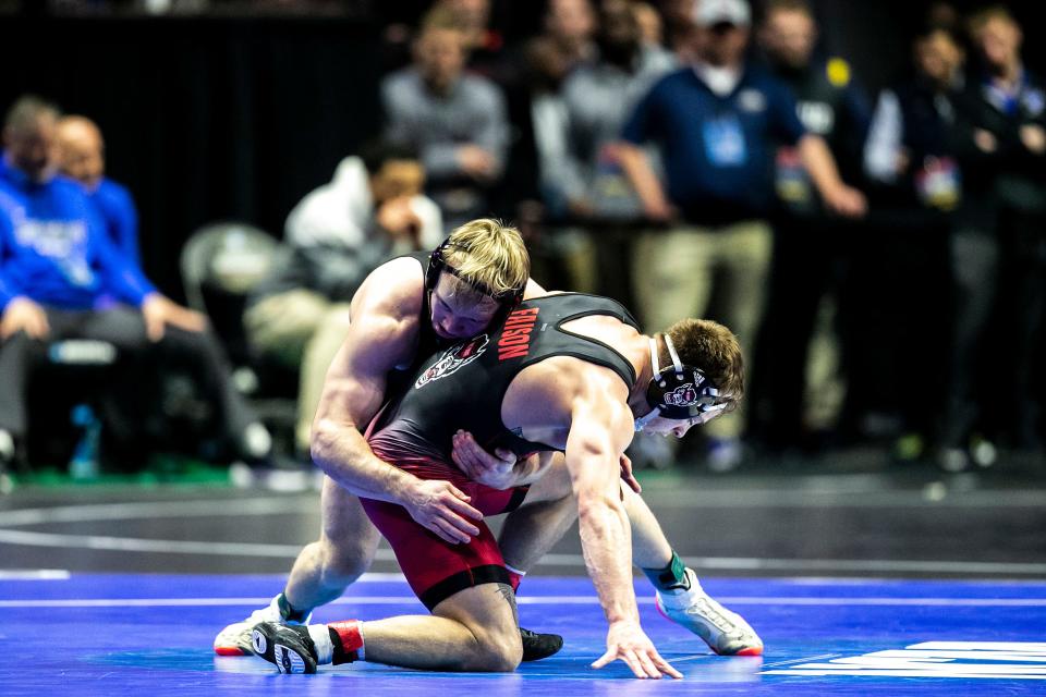 Iowa's Nelson Brands, left, wrestles North Carolina State Alex Faison at 174 pounds during the first session of the NCAA Division I Wrestling Championships, Thursday, March 16, 2023, at BOK Center in Tulsa, Okla.