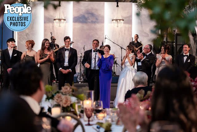 <p>Neringa Plank NeriPhoto</p> Jake Chelios and Madelyn Iacurci celebrate with guests at their wedding in Chicago on July 8, 2023