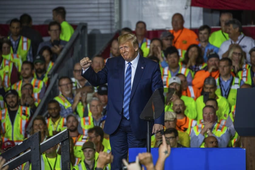 President Donald Trump leaves the stage after speaking to a crowd of construction workers before touring Royal Dutch Shell's petrochemical cracker plant on Tuesday, Aug. 13, 2019 in Monaca, Pa. (Andrew Rush/Pittsburgh Post-Gazette via AP)