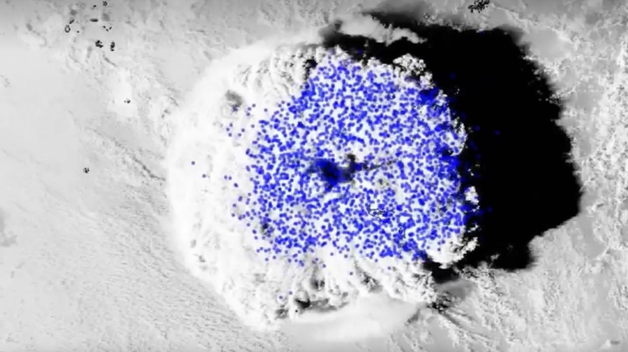  satellite image of a huge plume created by an undersea volcanic eruption near tonga in january 2022, with blue dots superimposed on top that represent lightning strikes within the plume 