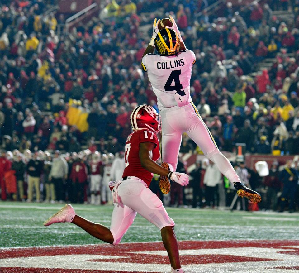 Michigan receiver Nico Collins catches a touchdown against Indiana defensive back Raheem Layne during the second half at Memorial Stadium, Nov. 23, 2019.