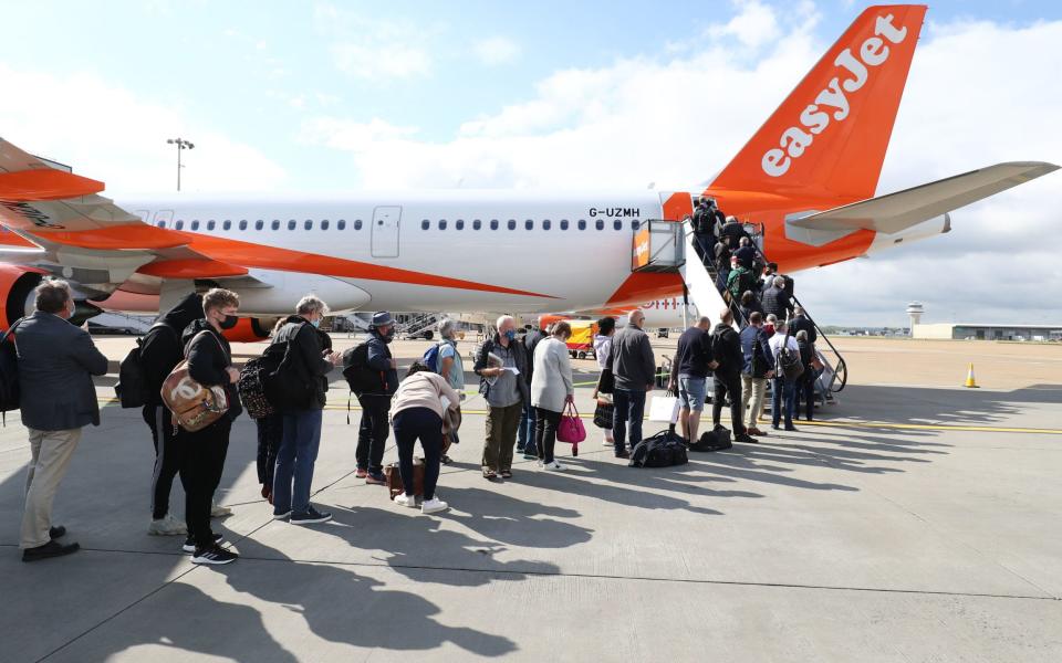 Passengers boarding an easyJet flight to Faro, Portugal, at Gatwick, 2021