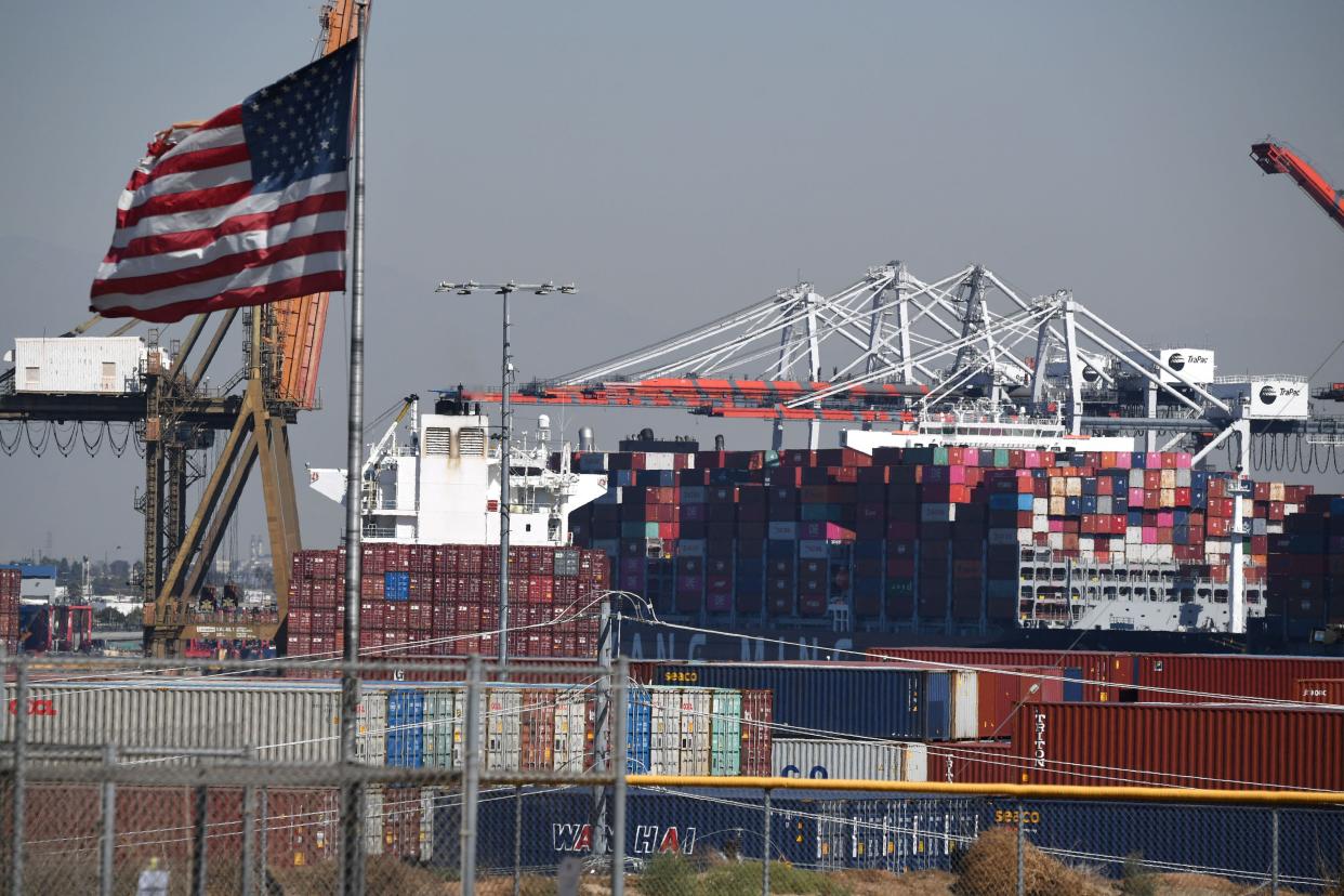 An American flag flies near the Port of Los Angeles, in San Pedro, California, October 13, 2021. (Photo by ROBYN BECK/AFP via Getty Images)