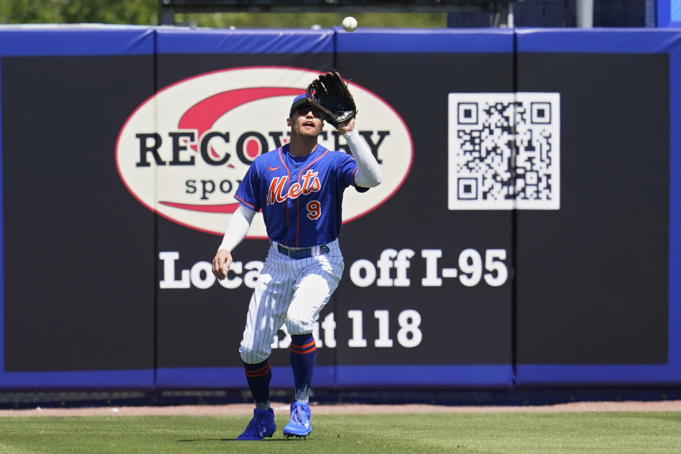 New York Mets center fielder Brandon Nimmo (9) catches a fly ball hit by Washington Nationals' Juan Soto in the first inning of a spring training baseball game, Saturday, March 26, 2022, in Port St. Lucie, Fla. (AP Photo/Sue Ogrocki)