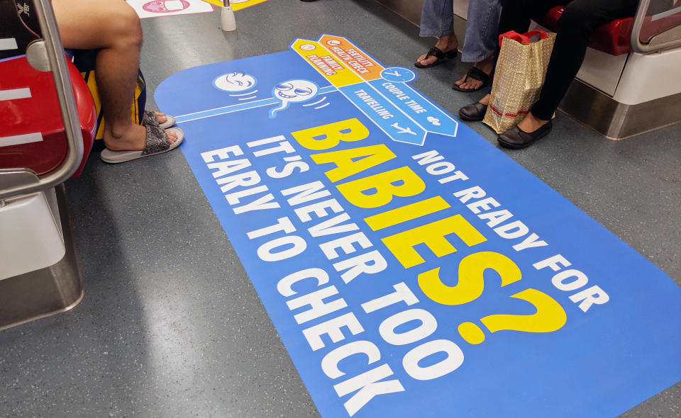 Key campaign visual seen on a NEL train on 4 July, 2019. (PHOTO: Yahoo News Singapore)