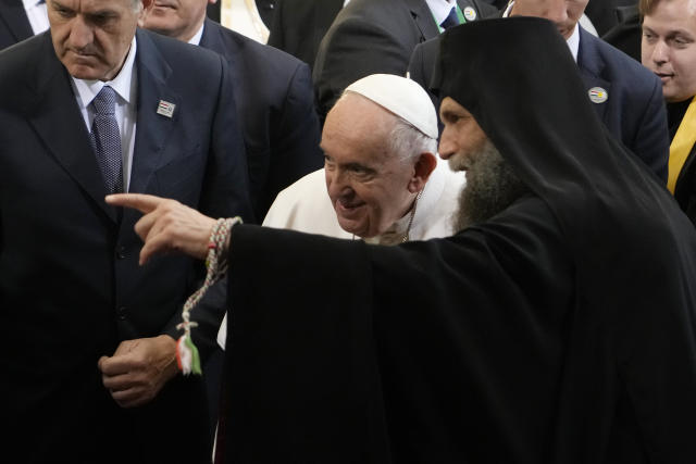 Pope Francis talks with metropolitan archbishop Peter Fulop Kocsis as he meets a Greek Catholic community in the "Protection of the Mother of God" church, in Budapest, Hungary, Saturday, April 29, 2023. The Pontiff is in Hungary for a three-day pastoral visit. (AP Photo/Andrew Medichini)