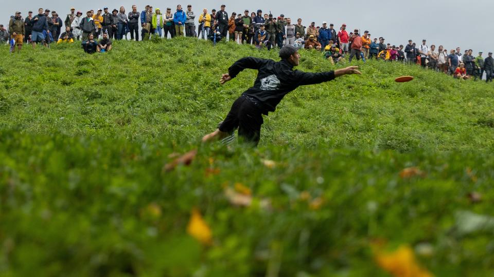 Spectators watch a competitor at the 2022 Green Mountain Championship for disc golf at Smugglers' Notch Ski Resort.
