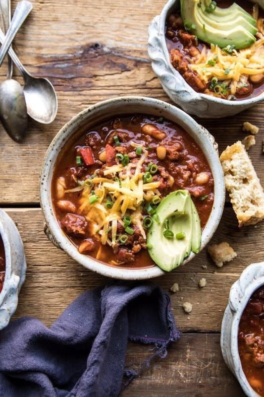 <p>Half Baked Harvest</p><p>This bowl of chili is a hearty, healthy and cozy dinner that you can feel good about eating. It's got round turkey, bell peppers, smoky chipotle peppers, white beans, and served with sharp cheddar cheese and avocado. This bowl of chili is a hearty, healthy and cozy dinner that you can feel good about eating.</p><p><strong>Get the recipe: <a href="https://www.halfbakedharvest.com/healthy-slow-cooker-turkey-and-white-bean-chili/" rel="nofollow noopener" target="_blank" data-ylk="slk:Healthy Slow Cooker Turkey and White Bean Chili;elm:context_link;itc:0;sec:content-canvas" class="link rapid-noclick-resp">Healthy Slow Cooker Turkey and White Bean Chili</a></strong></p>