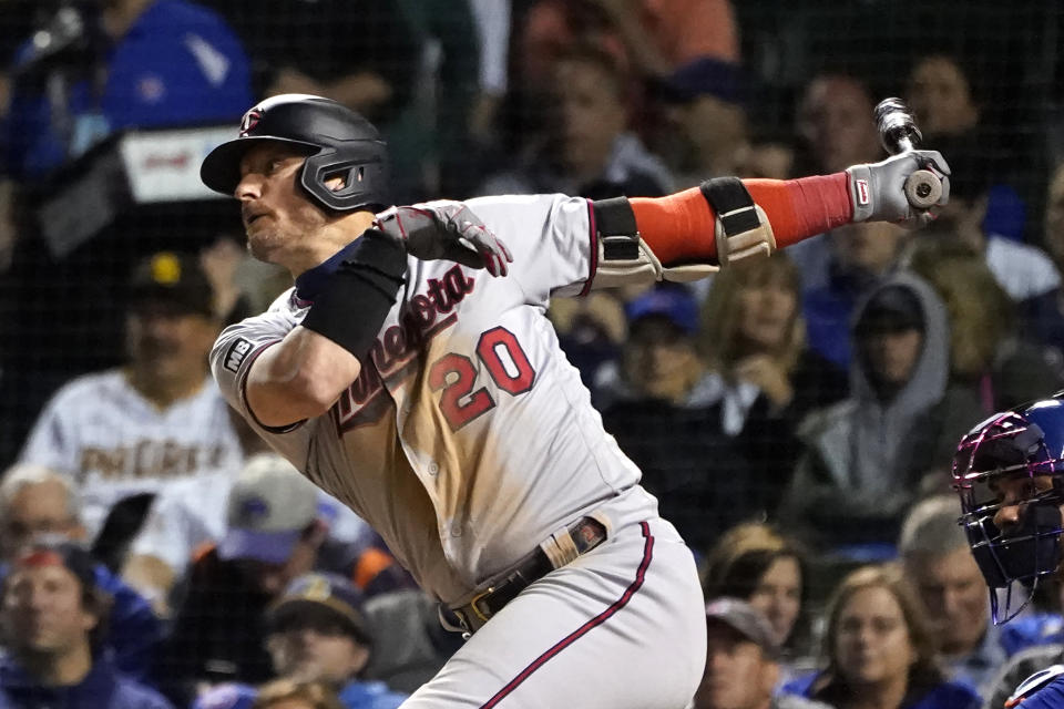 Minnesota Twins' Josh Donaldson watches his RBI single off Chicago Cubs relief pitcher Scott Effross during the fifth inning of a baseball game Tuesday, Sept. 21, 2021, in Chicago. (AP Photo/Charles Rex Arbogast)