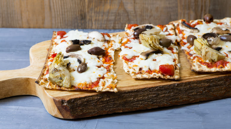 Three different matzah pizzas