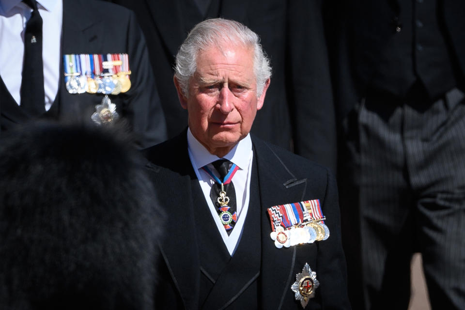 Prince Charles cries as he walks behind his father's coffin. 