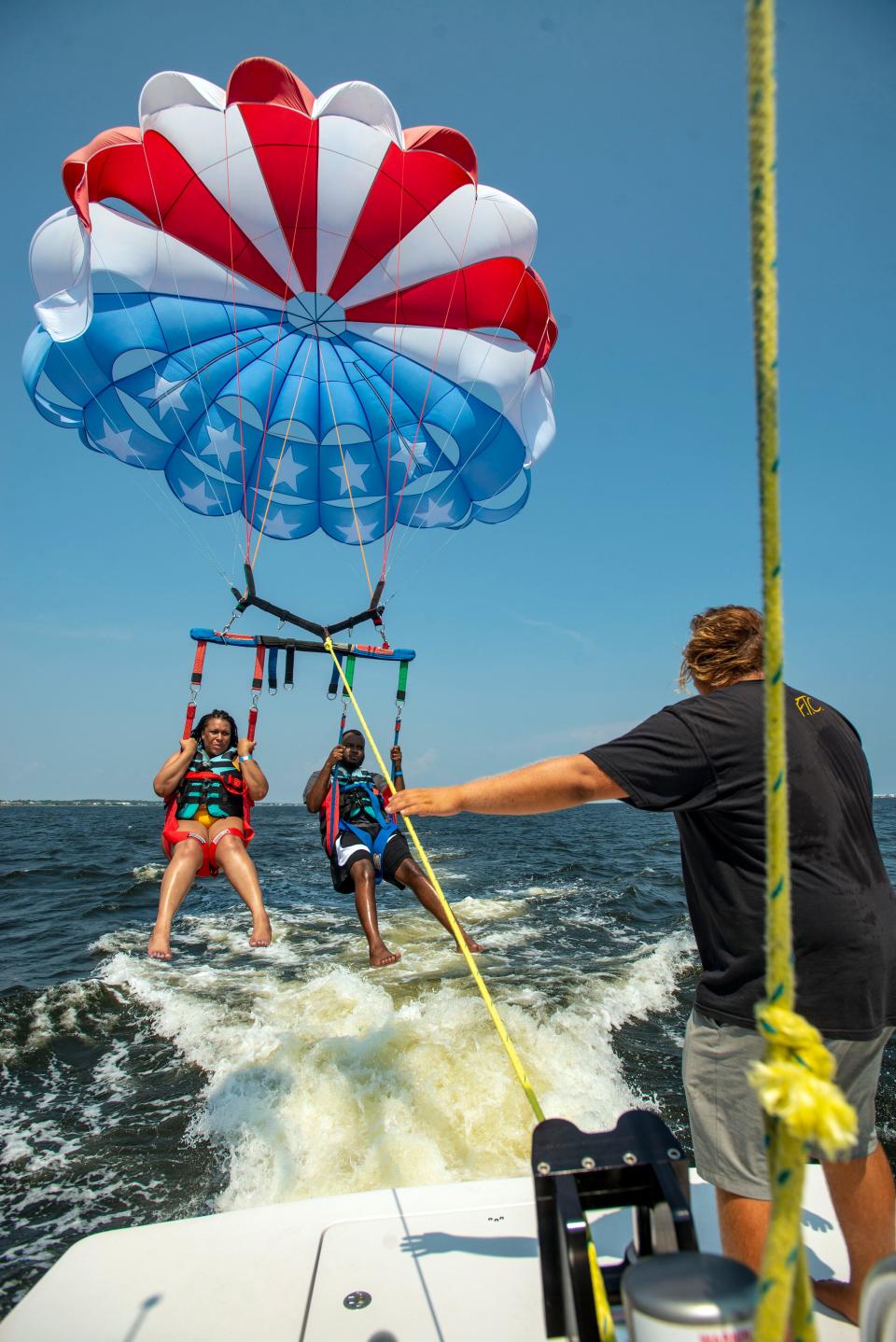 Stephanie Augustin and her boyfriend Pensacola News Journal sports reporter Patrick Bernadeau take to the skies over Santa Rosa Sound Sunday, August 1, 2021.