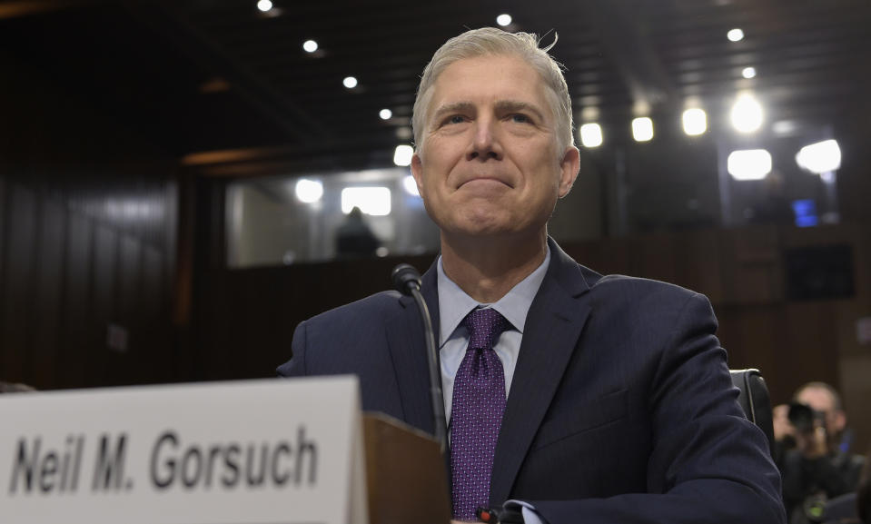 FILE - In this March 21, 2017, file photo Supreme Court Justice nominee Neil Gorsuch prepares to testify on Capitol Hill in Washington, at his confirmation hearing before the Senate Judiciary Committee. The Senate confirmed Neil Gorsuch to become the newest associate justice on the Supreme Court Friday, elevating President Donald Trump's nominee following a corrosive partisan confrontation that could have lasting impacts for the Senate and the court. (AP Photo/Susan Walsh, File)