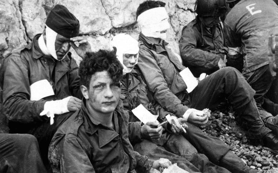 Injured US soldiers await evacuation on D-Day