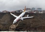 <p>A Pegasus airplane is seen stuck in mud as it skidded off the runway after landing in Trabzon Airport, Turkey early Sunday on Jan. 14, 2018. (Photo: Hakan Burak Altunoz/Anadolu Agency/Getty Images) </p>