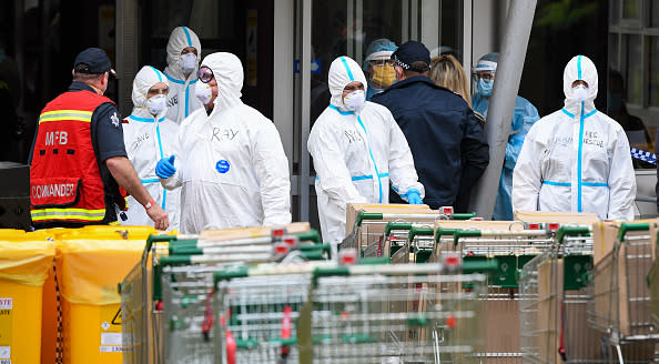 Members of the Melbourne Fire Brigade (MFB) prepare to take food parcels to residents in a locked down public housing estate in Melbourne as the city re-enters a city wide lockdown after a fresh outbreak of the COVID-19 coronavirus. 