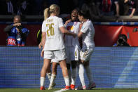 Lyon's Melchie Dumornay, center, celebrates after scoring her side's second goal during the women's Champions League semifinal, second leg, soccer match between Paris Saint-Germain and Olympique Lyonnais at Parc des Princes, in Paris, Sunday, April 28, 2024. (AP Photo/Thibault Camus)