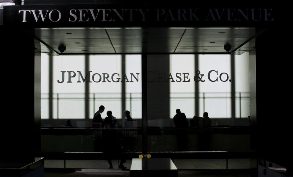People walk inside JP Morgan headquarters in New York, in this file photo from October 25, 2013. Names, addresses, phone numbers and email addresses of roughly 76 million households and seven million small businesses were exposed when computer systems at JPMorgan Chase & Co were hacked in a recent cyber attack, the company said in a statement October 2, 2014. REUTERS/Eduardo Munoz/Files (UNITED STATES - Tags: BUSINESS SCIENCE TECHNOLOGY LOGO)