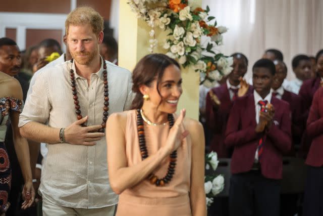 <p>KOLA SULAIMON/AFP via Getty</p> Prince Harry (Left) and Meghan Markle