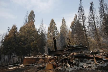 The remains of a structure burned by the King Fire is seen in White Meadows, northeast of Sacramento, California September 20, 2014. REUTERS/Stephen Lam