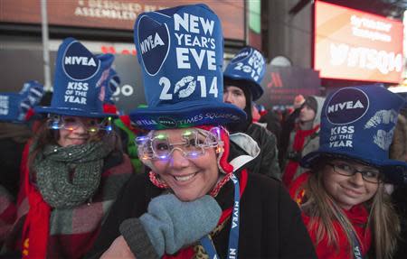 Katie Schroder from Indiana poses for a photo during New Year's Eve celebrations in Times Square in New York