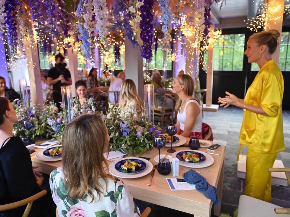 Gwyneth Paltrow presides over a gathering of devotees at the launch of her clean beauty product Goopglow in 2022 (Getty)