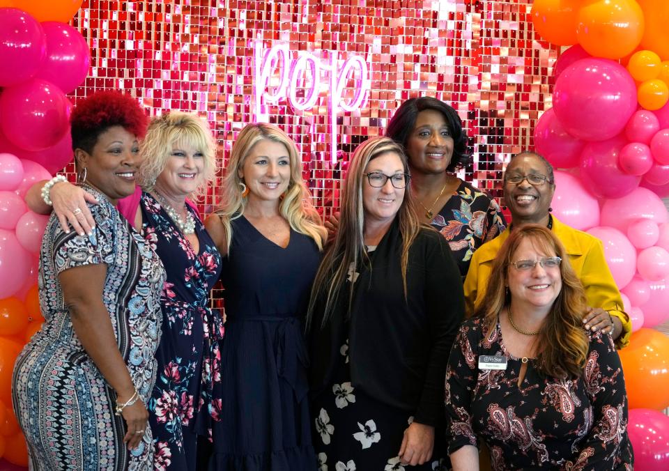 Attendees at Women United Volusia's 19th annual Power of the Purse luncheon at the Hilton Daytona Beach Oceanfront Resort gather for a group photo on Friday.