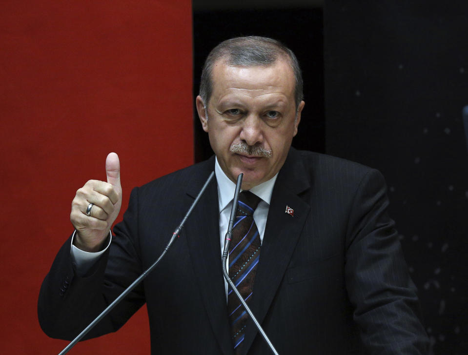 FILE - Turkish Prime Minister Recep Tayyip Erdogan gestures, as he addresses the members of his ruling Justice and Development Party in Ankara, Turkey, on Aug. 14, 2014. The 69-year-old who has served as prime minister since 2003 and president since 2014, started his career as a reformist who expanded rights and freedoms, allowing his majority-Muslim country to start European Union membership negotiations. (AP Photo/File)