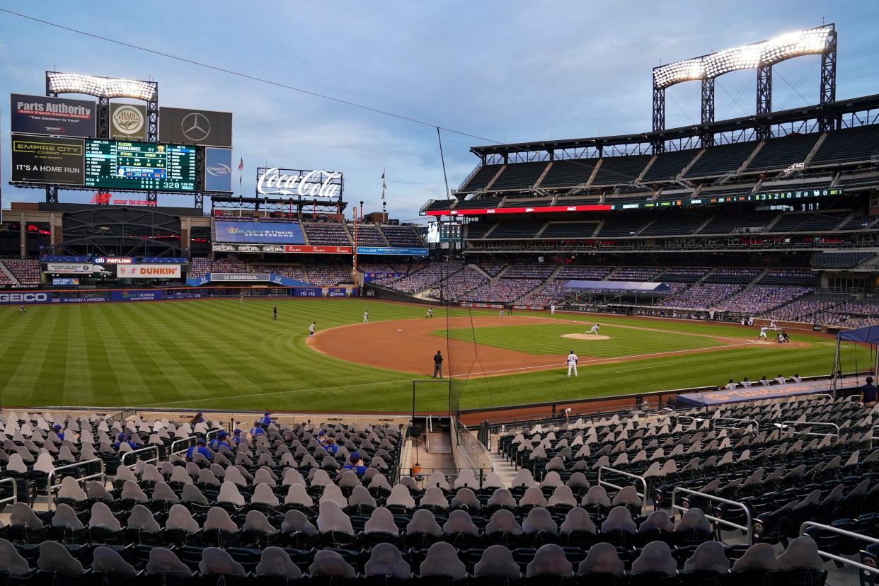 Miami Marlins starting pitcher Elieser Hernandez throws in the first inning of a baseball game against the New York Mets as cardboard cutouts of spectators populate the stands in the lower sections of Citi Field, Wednesday, Aug. 26, 2020, in New York. 