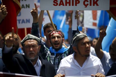 Demonstrators shout slogans during a protest against China near the Chinese Consulate in Istanbul, Turkey, July 5, 2015. REUTERS/Osman Orsal