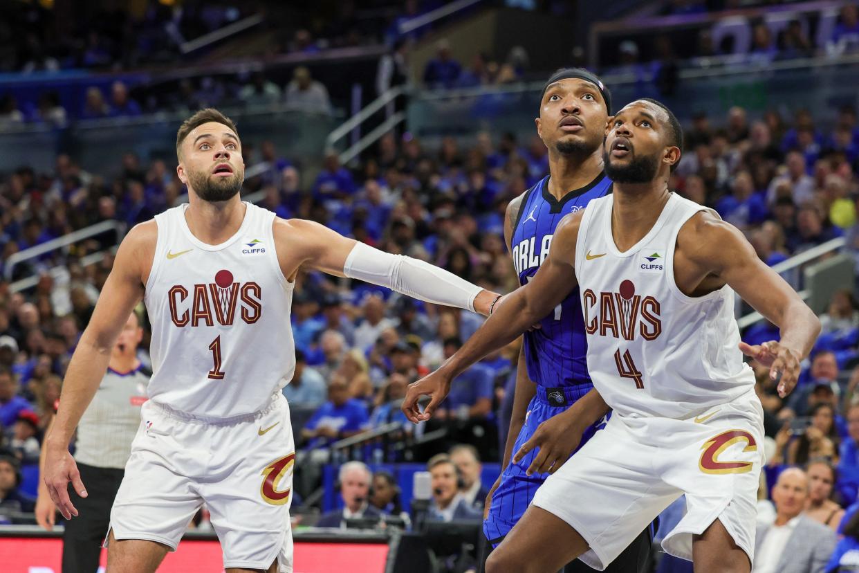 Cavaliers guard Max Strus (1) and forward Evan Mobley (4) try to box out Magic center Wendell Carter Jr. during the second quarter of Game 6 of a first-round playoff series, May 3, 2024, in Orlando.