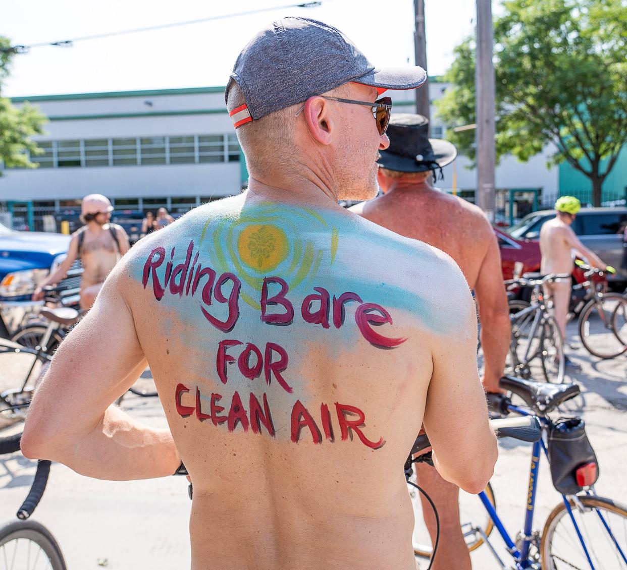 Paul Grunwald of Chicago prepares for the World Naked Bike Ride, a 15 mile route starting at Kochanski’s Concertina Beer Hall, in Milwaukee.