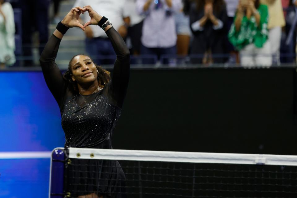 Serena Williams gives a heart to the crowd after falling in the third round of the U.S. Open.