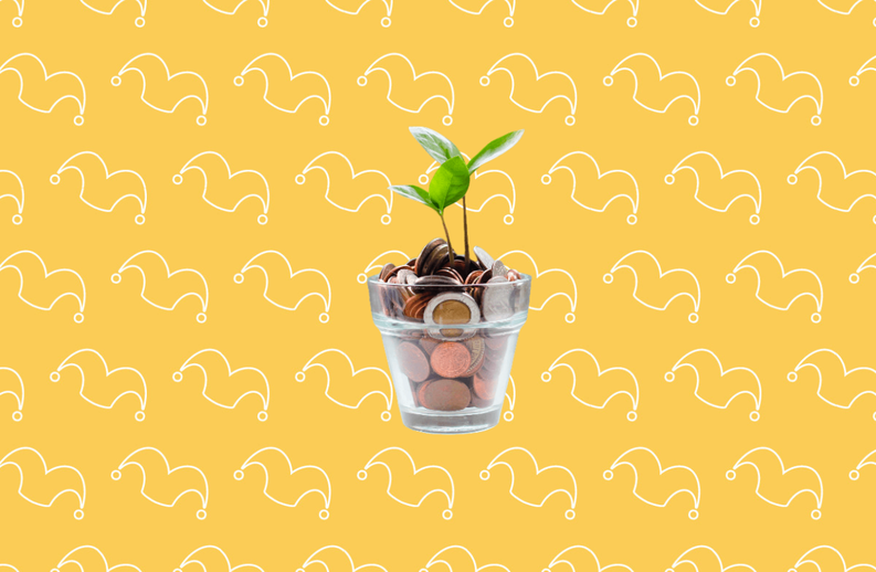 A class pot filled with coins and a sprout growing