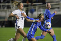 North Carolina's Maddie Dahlien (5) and UCLA's Quincy McMahon battle for the ball during the first half of the NCAA women's soccer tournament final in Cary, N.C., Monday, Dec. 5, 2022. (AP Photo/Ben McKeown) (AP Photo/Ben McKeown)