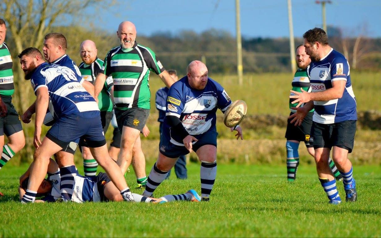 Sean Murphy, centre of image throwing a ball